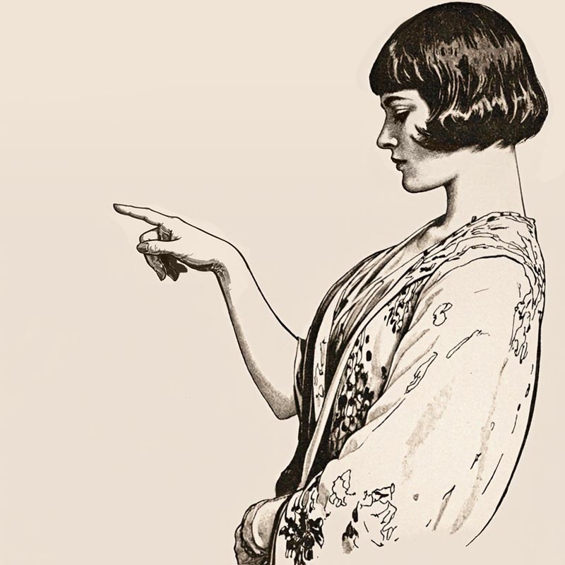 Eine 1920er Jahre Frau zeigt mit dem Finger